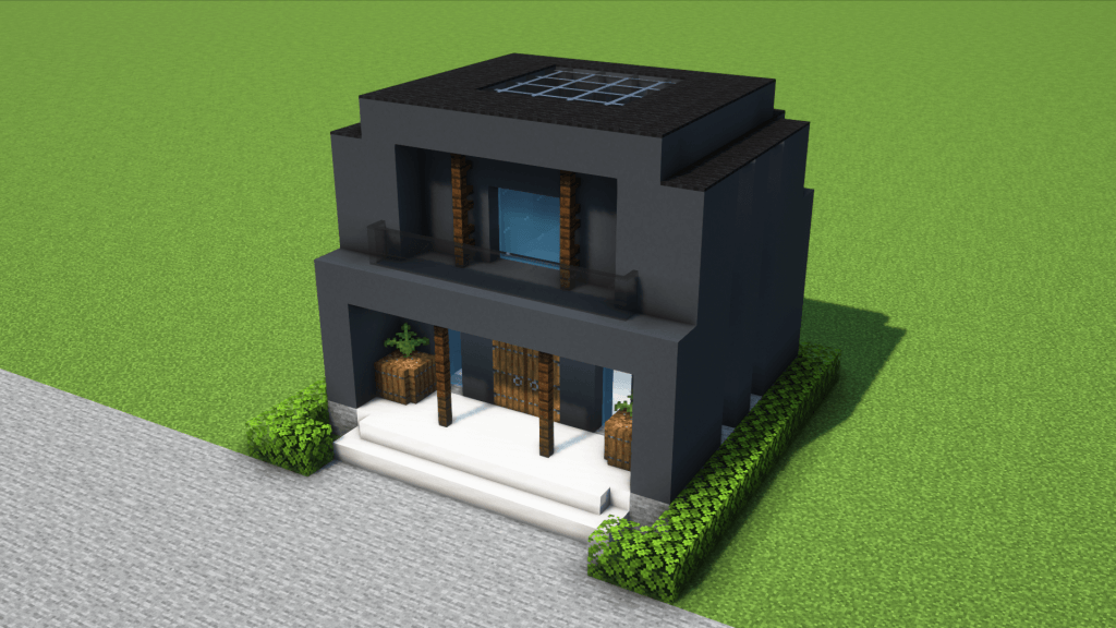 コンパクトでモダンな左右対称の黒い家。ソーラーパネル付き