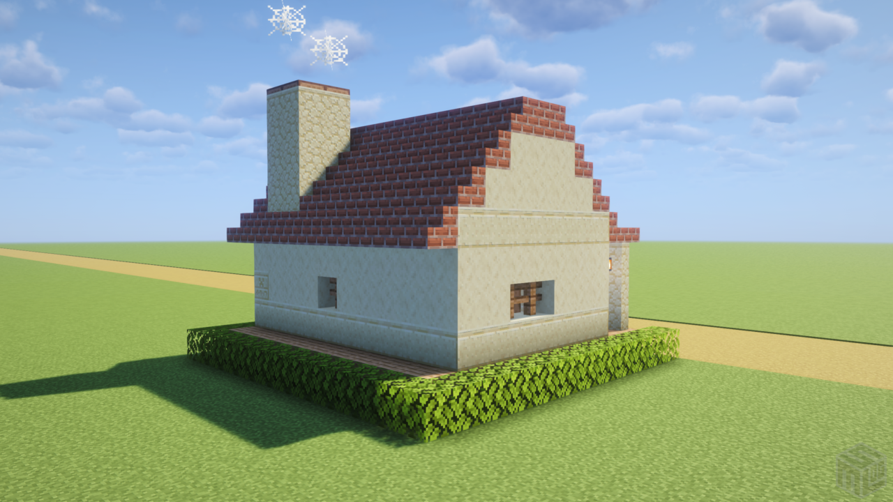 煙突付きレンガ屋根の小さい家。背面から