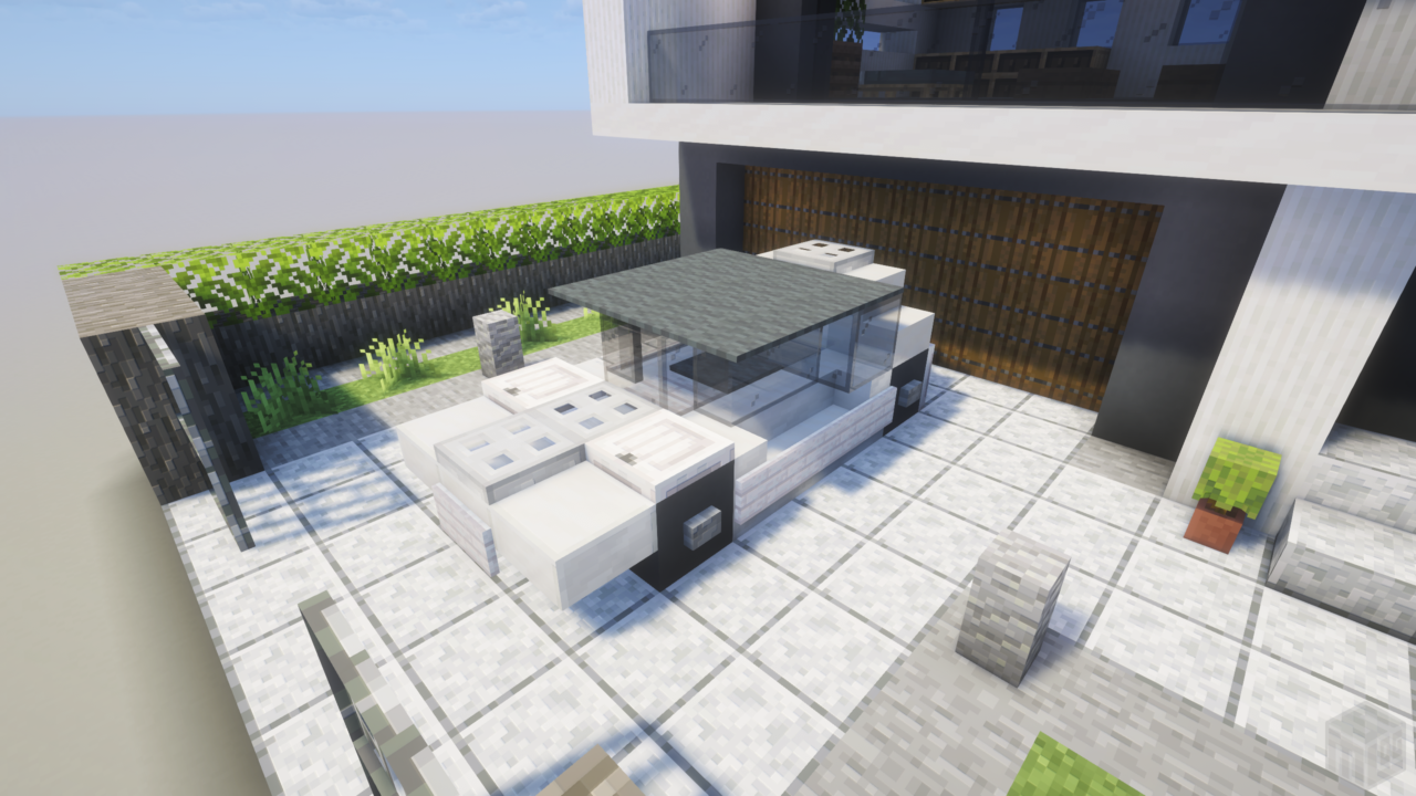 ガレージの前の白い車。